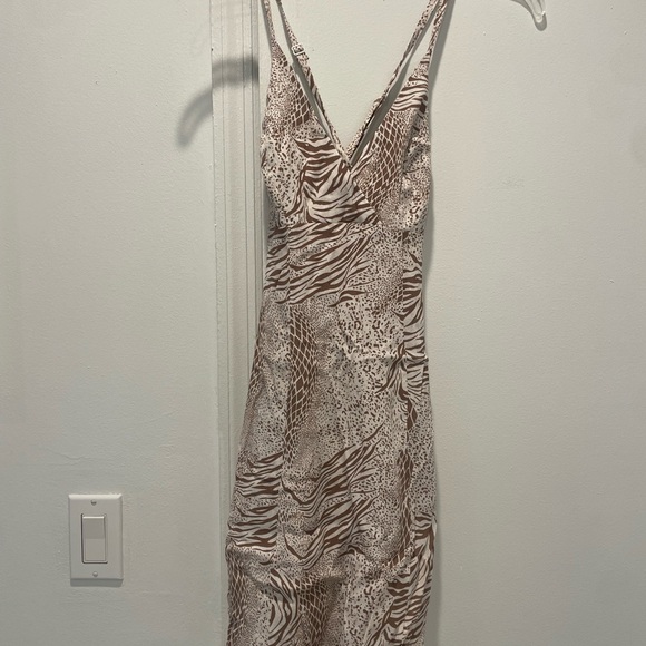 Urban Outfitters Dresses & Skirts - Kimchi Blue Urban Outfitters Animal Print Mini Dress Open Back Bow NWT